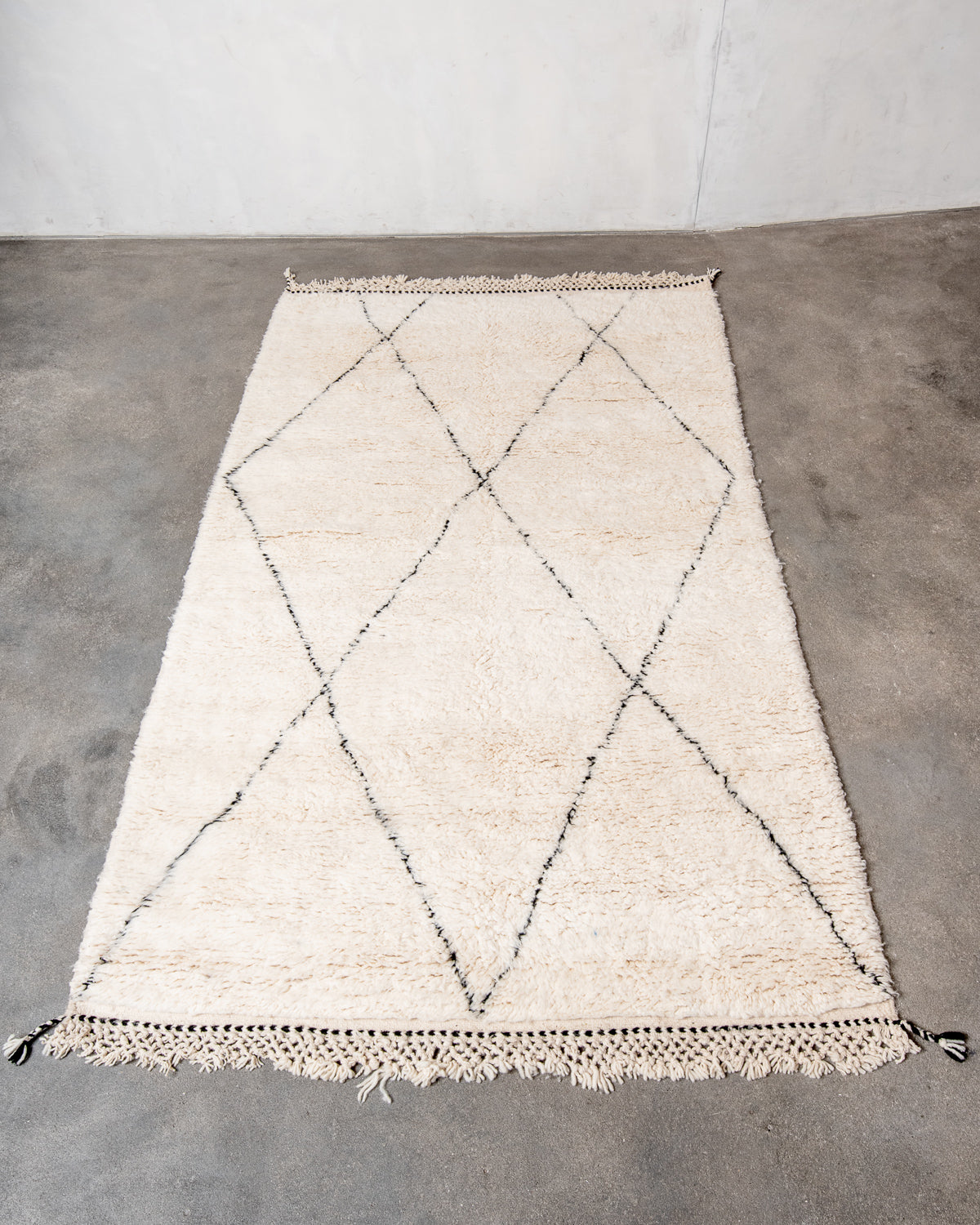 Modern, designer, handcrafted Berber rug from Morocco. Beniourain carpet with minimalist design, natural wool pile and a fluffy texture.